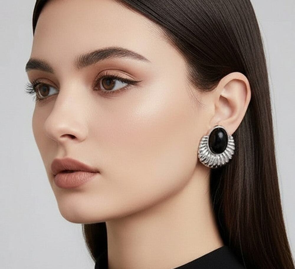 Clip on 1" silver indented oval earrings with black stone
